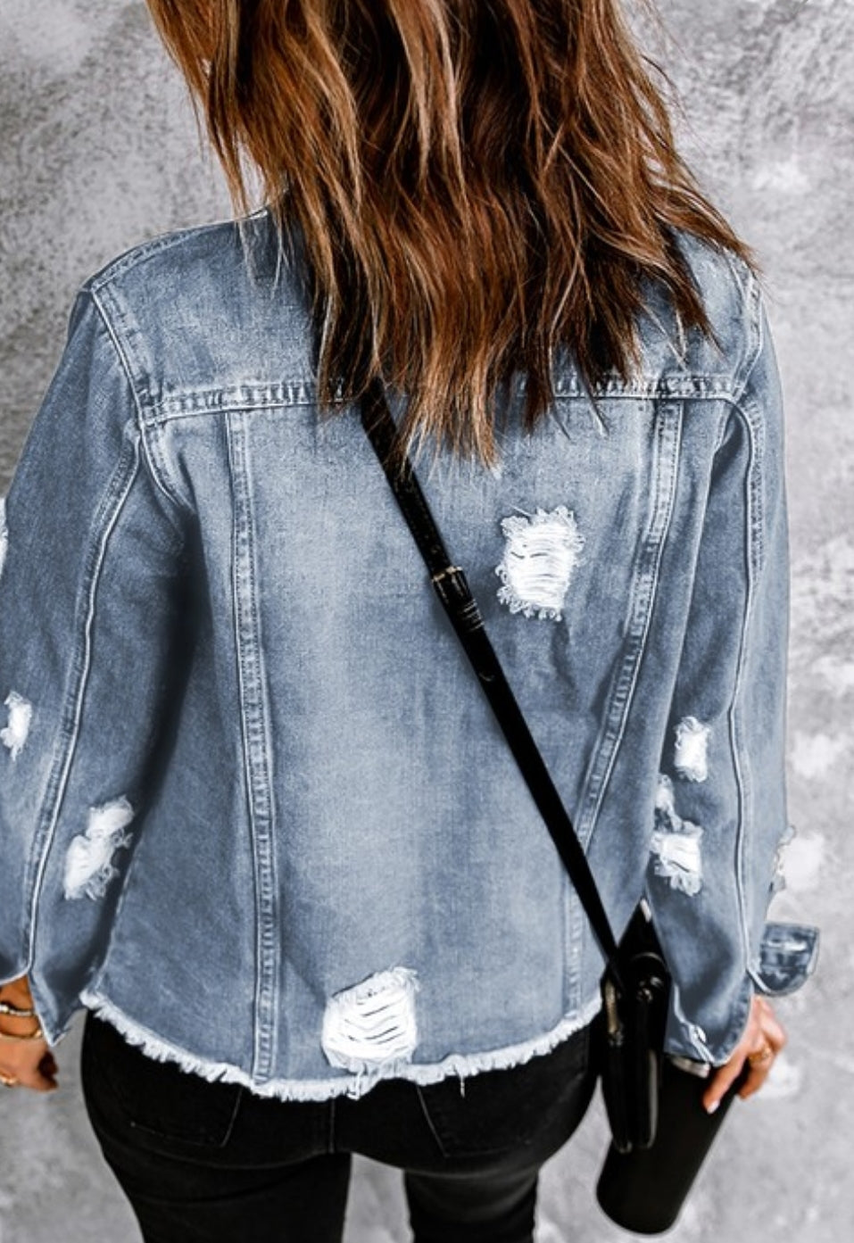 Distressed denim jacket